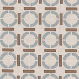 Detail of fabric in a round geometric grid print in light brown and blue on a tan field.