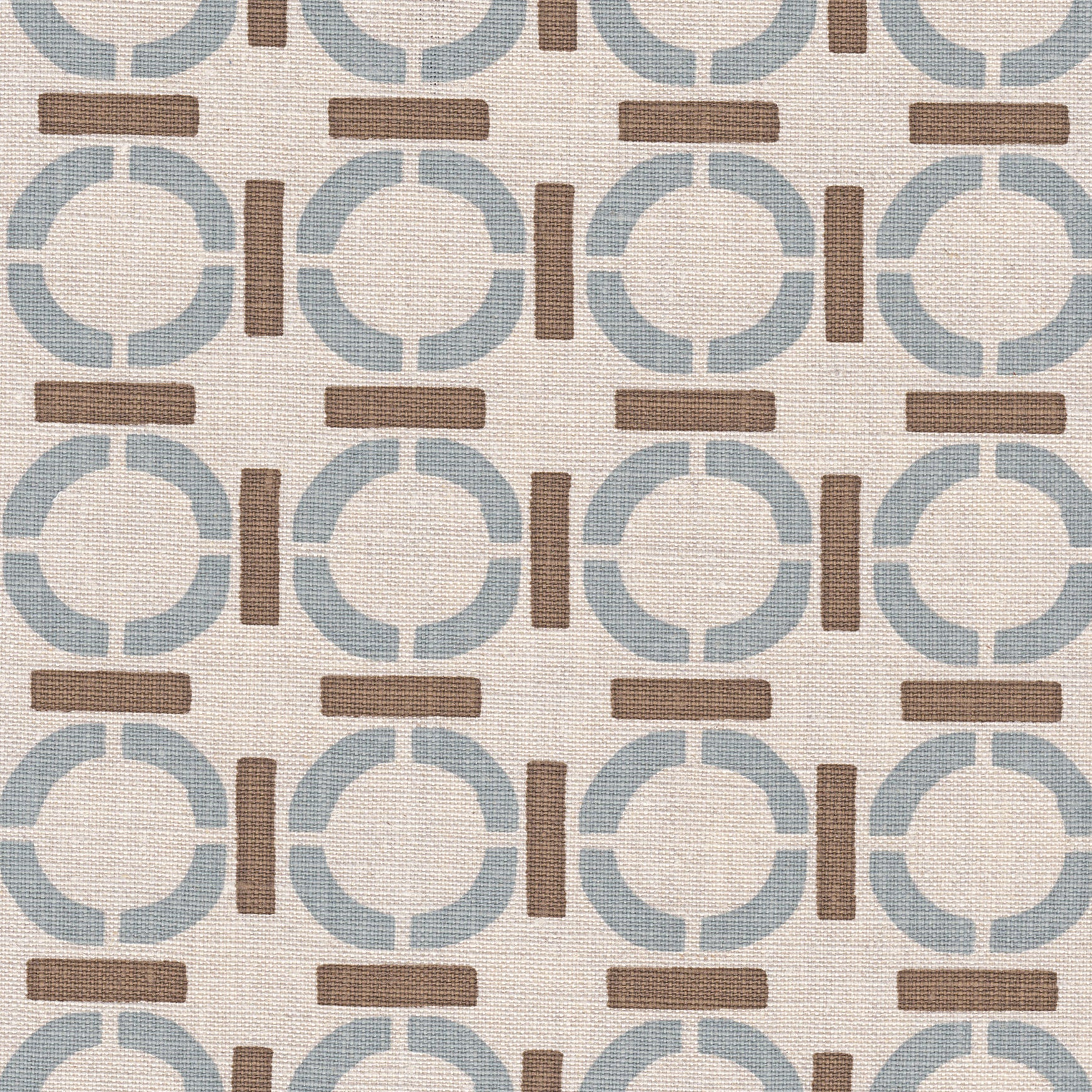 Detail of fabric in a round geometric grid print in light brown and blue on a tan field.