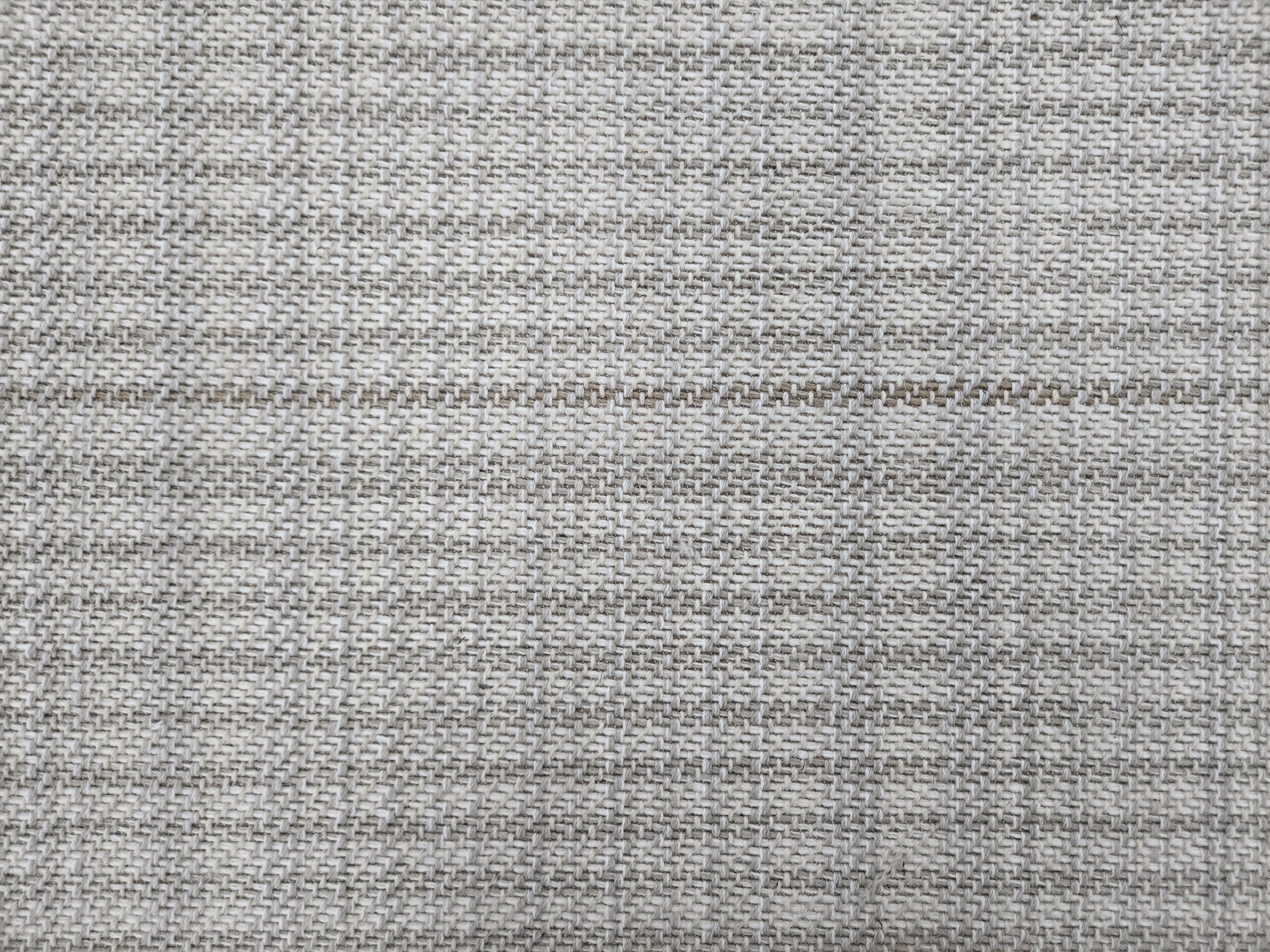 Broadloom carpet in a cream and cool blue.