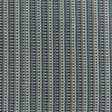 Detail of a hand-woven cotton fabric in an intricate grid pattern in shades of navy, brown, teal and white.