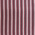 Detail of a hand-woven cotton fabric in an intricate stripe pattern in shades of pink, red, white and blue.