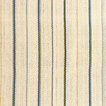 Detail of a hand-woven cotton fabric in an irregular stripe pattern in blue, yellow and green on a cream field.