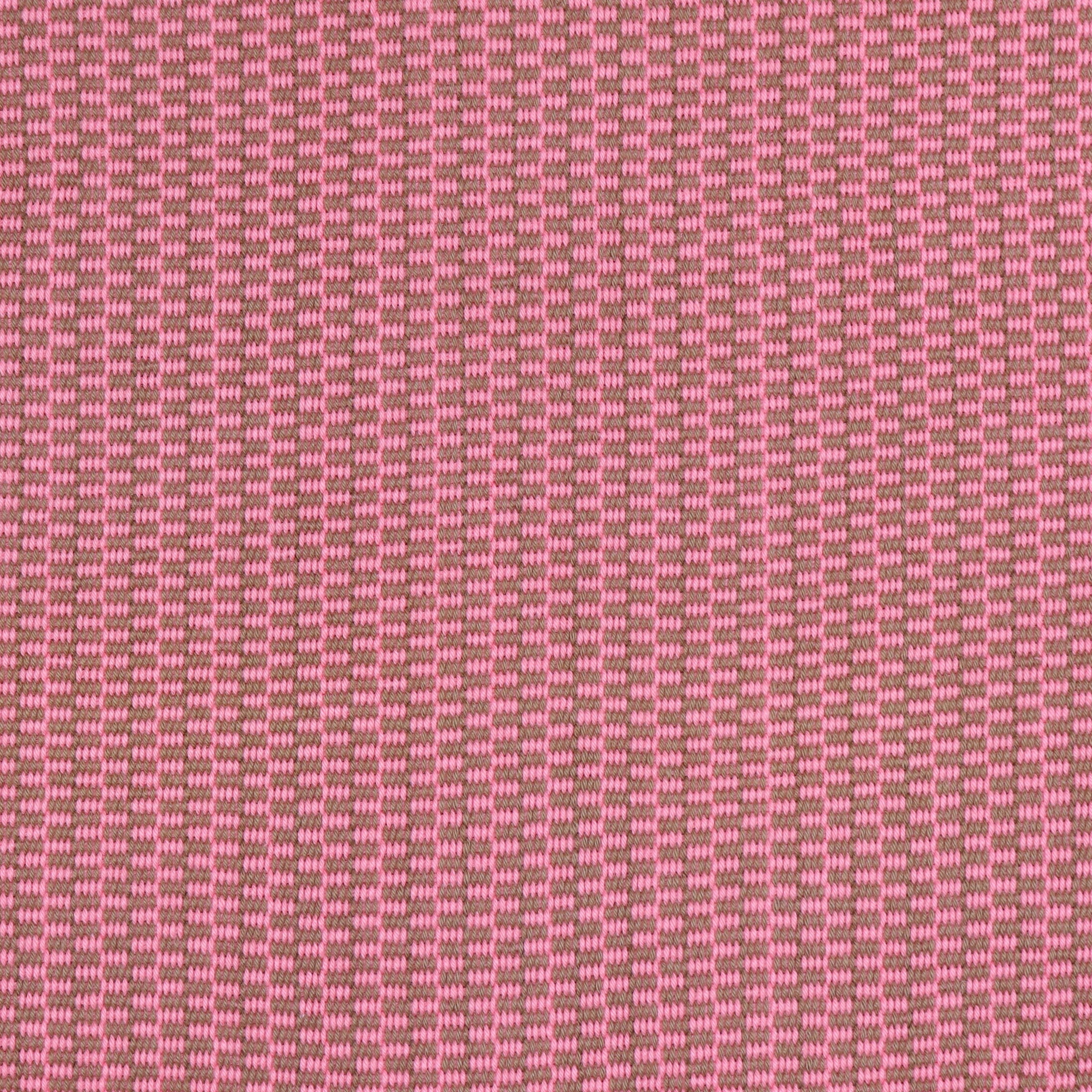 Detail of a hand-woven cotton fabric in a grid pattern in pink and brown.