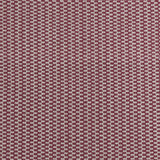 Detail of a hand-woven cotton fabric in a grid pattern in light gray and maroon.