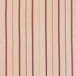 Detail of a hand-woven cotton striped fabric in cream brown, red and pink.