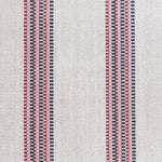 Detail of a hand-woven cotton fabric in an irregular stripe pattern in navy, red and pink on a white field.