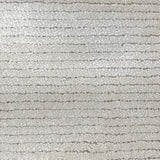 Broadloom carpet in a lightly ribbed cut pile in cool white. 