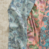 Gently draped fabric cuttings with a abstract dotted floral design in various colors. 