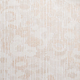 Close up of wallpaper with a pointillist abstract floral pattern in shades of beige on white. 