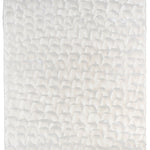 Sheet of hand-painted wallpaper with a repeating dappled texture in cream.