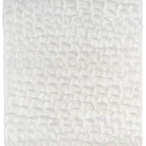 Sheet of hand-painted wallpaper with a repeating dappled texture in cream.
