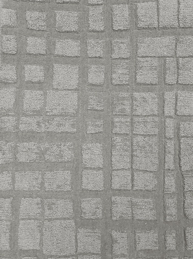 Broadloom carpet sample in a irregular plaid pattern in pale grey