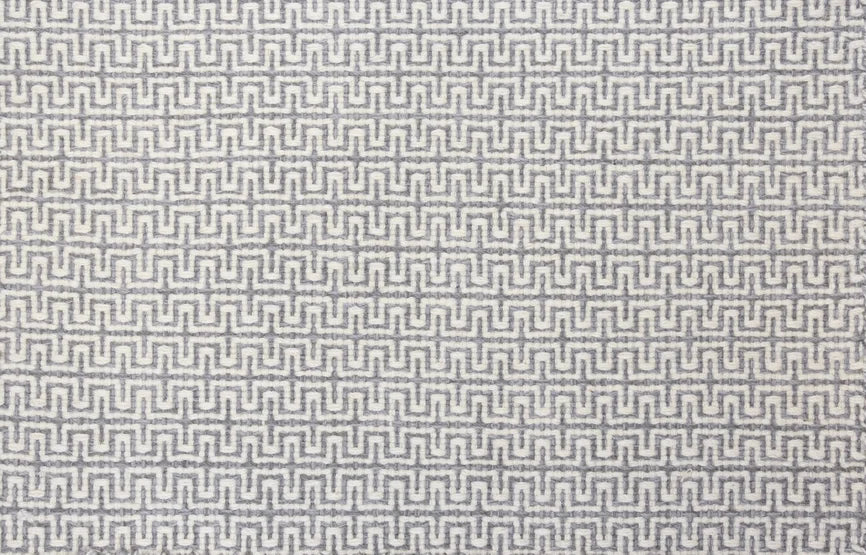 Broadloom carpet swatch in a geometric pattern in a grey white design