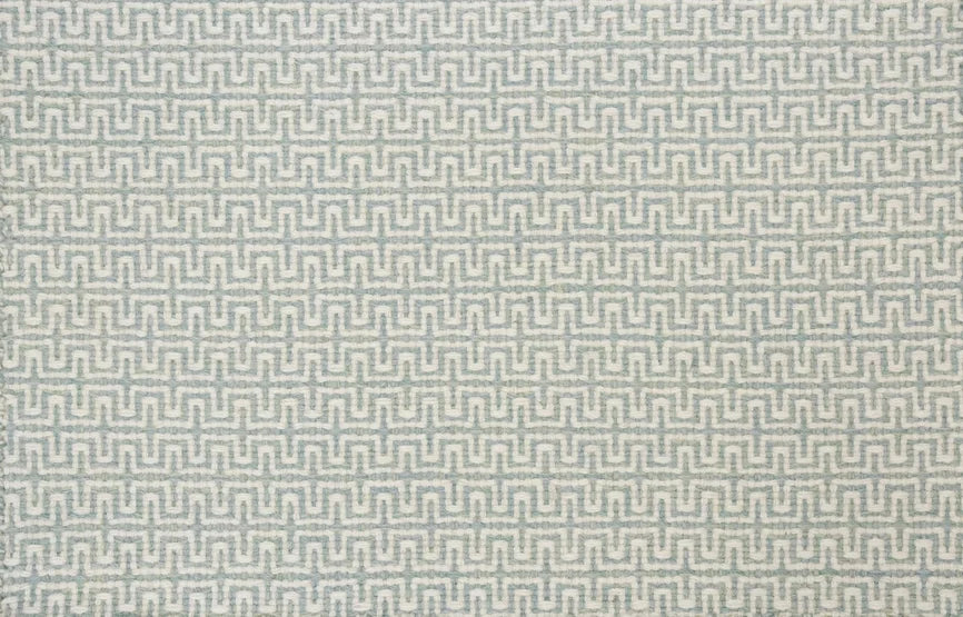 Broadloom carpet swatch in a geometric pattern in a grey light blue design