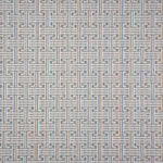 Patterned carpet with a geometric design in blue, grey tan, green and white