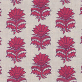 Detail of fabric in a repeating thistle print in pink and purple on a tan field.
