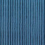 Fabric in a painterly stripe pattern in navy on a blue field.