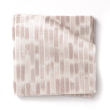 Stacked swatches of fabric in a linear check pattern in shades of pastel mauve on a white field.
