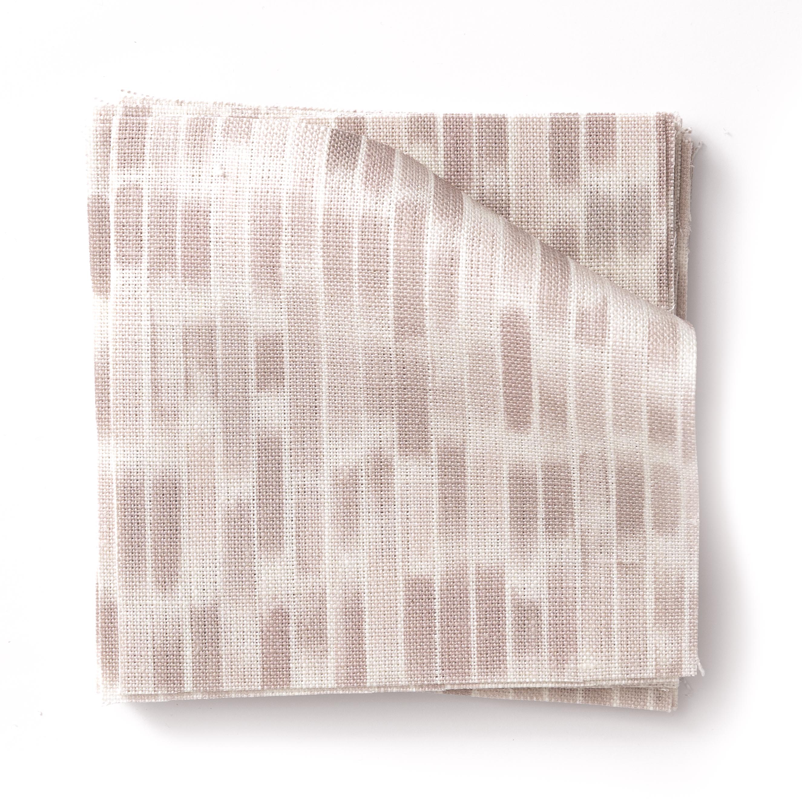 Stacked swatches of fabric in a linear check pattern in shades of pastel mauve on a white field.
