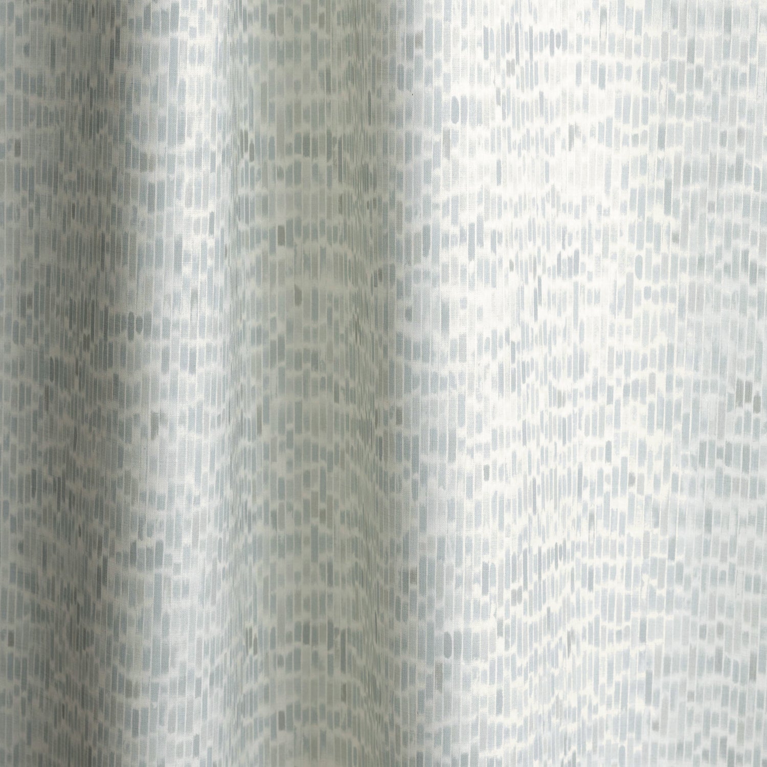 Gently draped fabric in a linear check pattern in shades of pastel aqua blue on a white field.