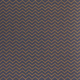 Patterned fabric with tan zigzag design on a navy background