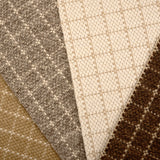 Broadloom carpet with windowpane check pattern in neutral colors. 