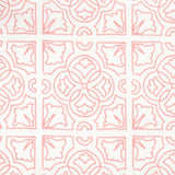 Detail of fabric in a damask lattice print in pink on a white field.