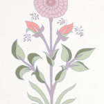 Detail of fabric in a large-scale marigold print in pink, purple and green on a white field.