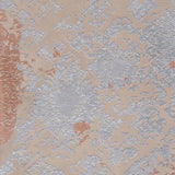 Detail of wallpaper in a textural botanical print in metallic silver and brown on a tan field.