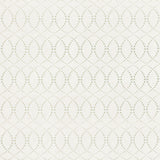 Detail of fabric in a playful floral lattice print in orange and turquoise on a cream field.