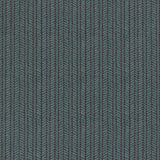 Wallpaper panel in a painterly herringbone print in green and light blue on a navy field.