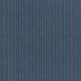 Wallpaper panel in a painterly herringbone print in turquoise and pink on a navy field.