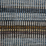 Handwoven carpet in a variegated stripe in shades of blue blue, charcoal, brown,  yellow and tan. 