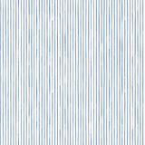Detail of fabric in a painterly stripe pattern in navy on a white field.