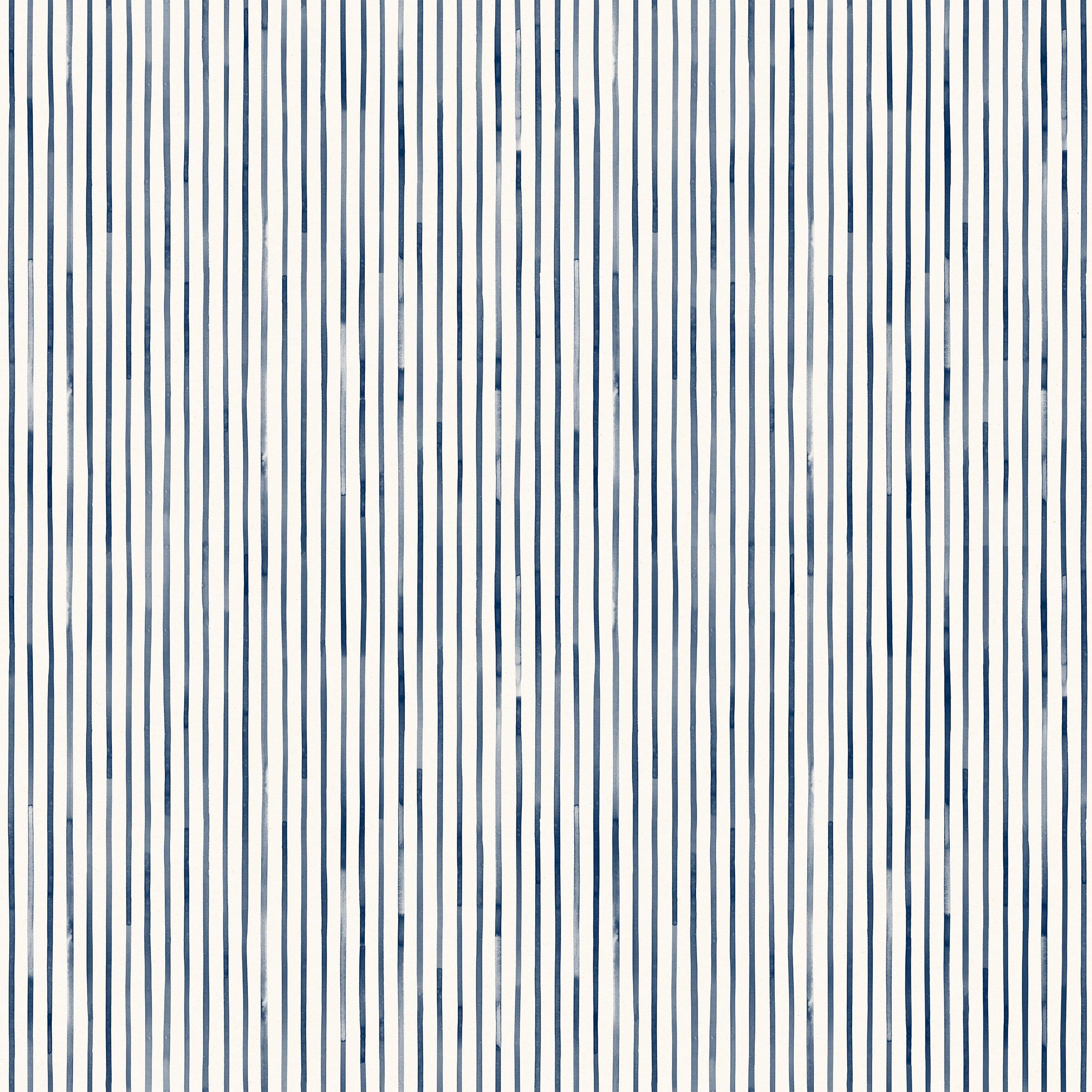 Detail of wallpaper in a painterly stripe pattern in navy on a white field.