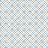 Detail of wallpaper in a painterly grid pattern in navy on a white field.