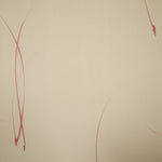 Detail of a wallpaper in an elongated paint splatter pattern in metallic navy on a rust field.