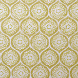 Detail of fabric in a floral lattice print in yellow on a cream field.