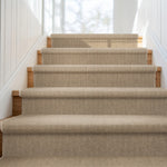 Carpeted staircase with wooden steps in a home setting