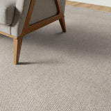 Beige carpet with a chair on a wooden floor