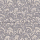 Detail of fabric in a marbled paint print in shades of gray and cream.
