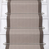 Striped flatweave runner in grey and dark grey on white staircase