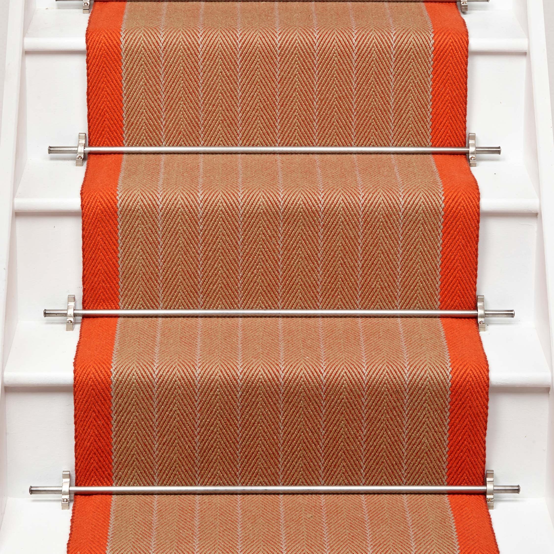 Striped flatweave runner in orange on white staircase
