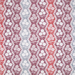Fabric in a detailed botanical stripe print in shades of blue, red and purple on a white field.