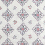 Scaled-out view of fabric in a diamond damask print in shades of pink, purple, blue and green on a cream field.