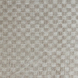 Close up of woven fabric with small scale checkerboard pattern in white and beige.