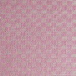 Close up of woven fabric with small scale checkerboard pattern in white and bright pink. 