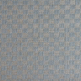 Close up of woven fabric with small scale checkerboard pattern in white and pastel blue.