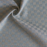 Close up of draped woven fabric with small scale checkerboard pattern in white and pastel blue.