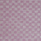 Close up of woven fabric with small scale checkerboard pattern in white and bubble gum pink.